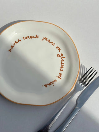 Maegen Statement Plate 'Never count years or glasses of wine'